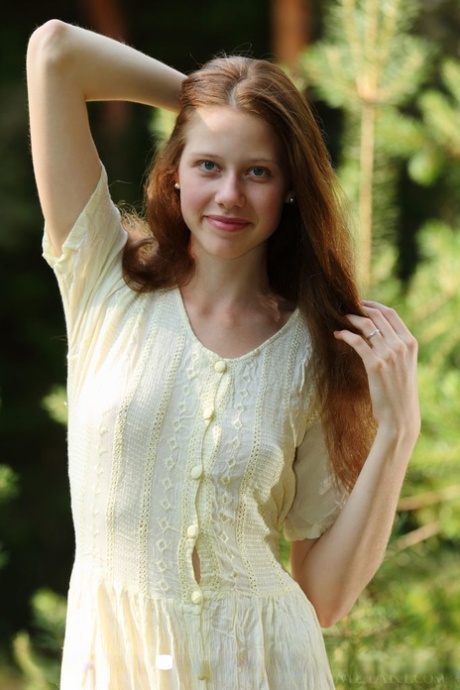Pale girl with long red hair Nicole K gets totally naked amid saplings 32511539