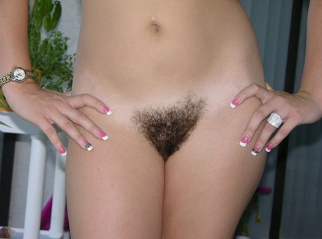 Amateur girl shows off her tidily trimmed muff with just her glasses on 34829506