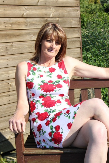 Mature mom sheds sun dress in the yard to show small saggy tits & spread naked 78739074