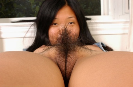 Amateur Asian brunette Janet with tiny tits shows off her hairy pussy 96289228