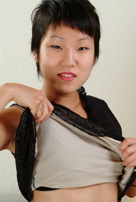Close up of petite Oriental chick Vicky revealing nice tits and beaver 26858226