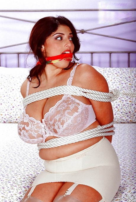 Busty balled gagged Euro pornstar Kerry Marie undergoing BDSM session