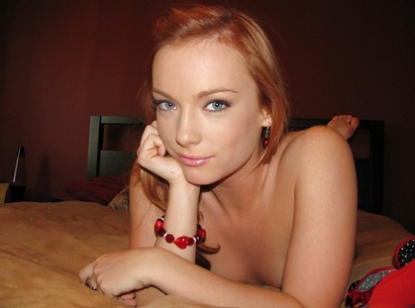 Natural redhead gf Dani Jensen showing off her naked pussy on bed 82022263