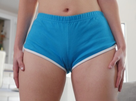 Clothed teen Lucie Cline quickly doffs shorts and thong for nude posing 98289263