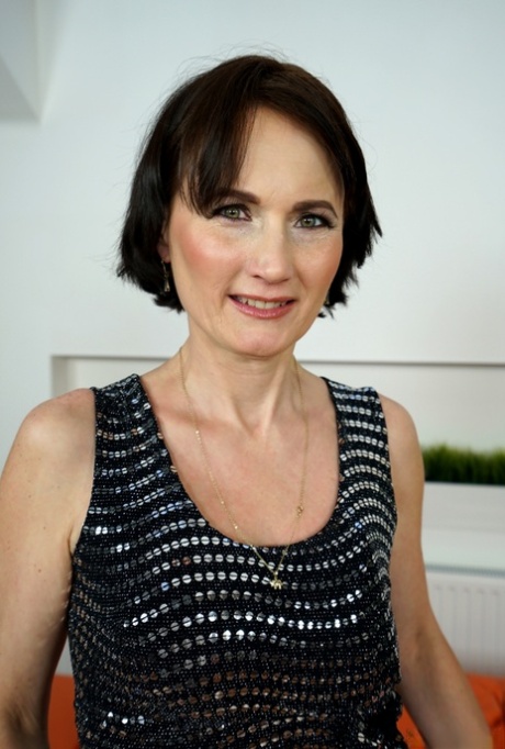 Short haired granny Alice Sharp bares her saggy tits as she strips naked 37639221