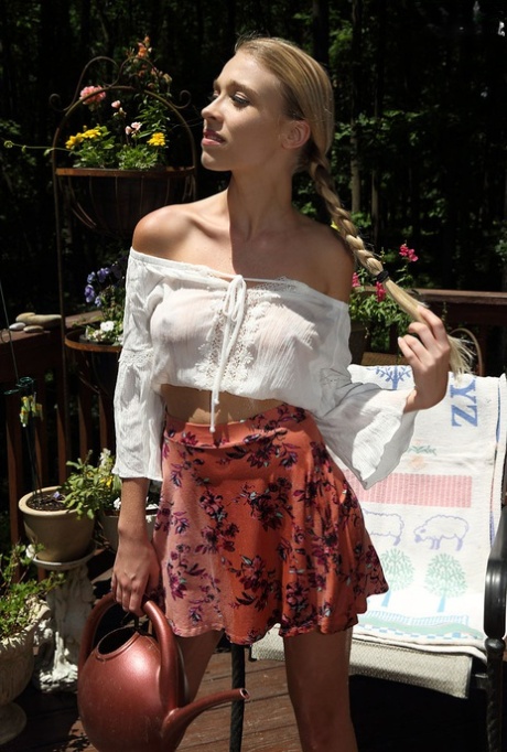 Innocent blonde girl Kali Renee fills her twat with a watering can on the deck 16229288
