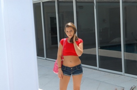 Tight shorts hug big ass of horny babe Sasha Hall posing outdoors 17910549