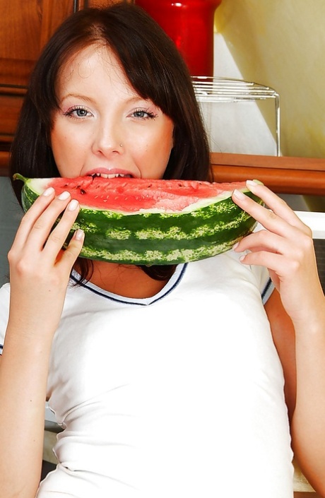 Seductive teen brunette stripping and getting her body wet in the kitchen 89161654