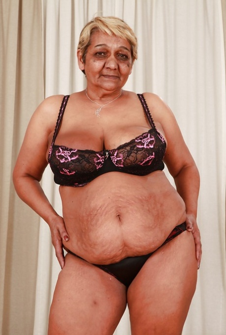 Fatty granny with big flabby boobs stripping off her suit and lingerie 43595487