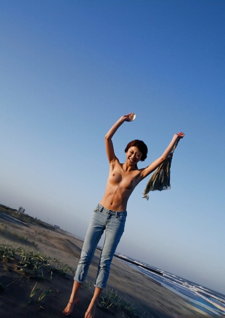 Lovely asian babe Yu Satome uncovering her big tits outdoor 99944500
