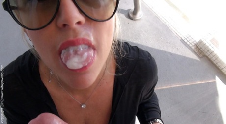 Mature lassie in sunglasses gives a handjob and takes a cumshot on her tongue 65274176