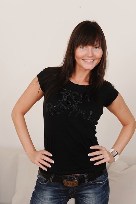 Smiley brunette with graceful curves undressing and exposing her goods 24674778