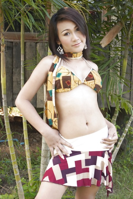 Gorgeous Thai ladyboy Gelly and her uncut shecock posing solo outdoors 25781290